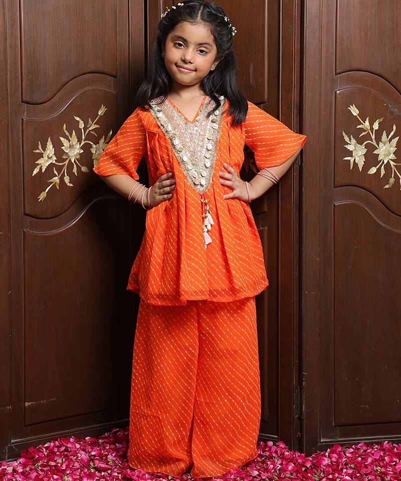 Vibrant orange embroidered georgette kurti set
