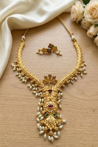 Gold plated traditional indian necklace set with pearls, ruby and emerald accents