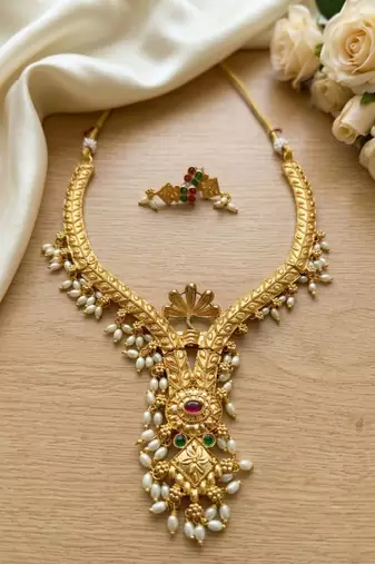 Gold plated traditional indian necklace set with pearls, ruby and emerald accents