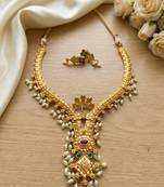 Gold plated traditional indian necklace set with pearls, ruby and emerald accents