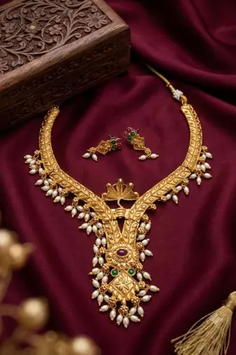 Gold plated traditional indian necklace set with pearls, ruby and emerald accents