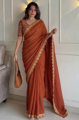 Appetizing orange embroidery cutwork work lace border rangoly silk party wear saree 1