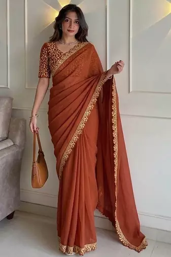 Appetizing orange embroidery cutwork work lace border rangoly silk party wear saree