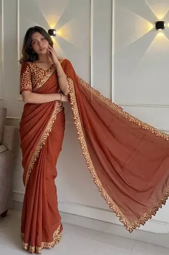 Appetizing orange embroidery cutwork work lace border rangoly silk party wear saree