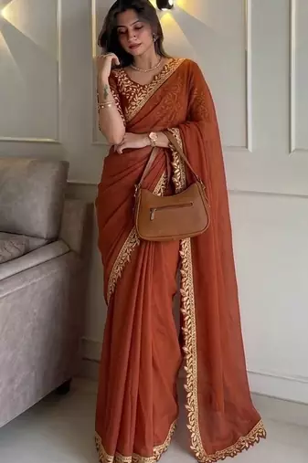 Appetizing orange embroidery cutwork work lace border rangoly silk party wear saree