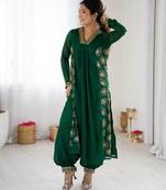 Dark green color designer partywear attire for trendy ceremonial looks