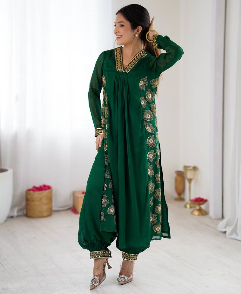 Dark green color designer partywear attire for trendy ceremonial looks