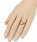 Pearl finger ring with silver-tone filigree band, adjustable