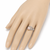 Pearl finger ring with silver-tone filigree band, adjustable