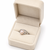 Pearl finger ring with silver-tone filigree band, adjustable