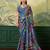 Blue color elegant crepe silk saree with designer print design and trendy mirror work