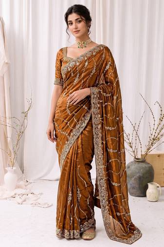 Gold color elegant space silk fabric rich looks embroidered saree