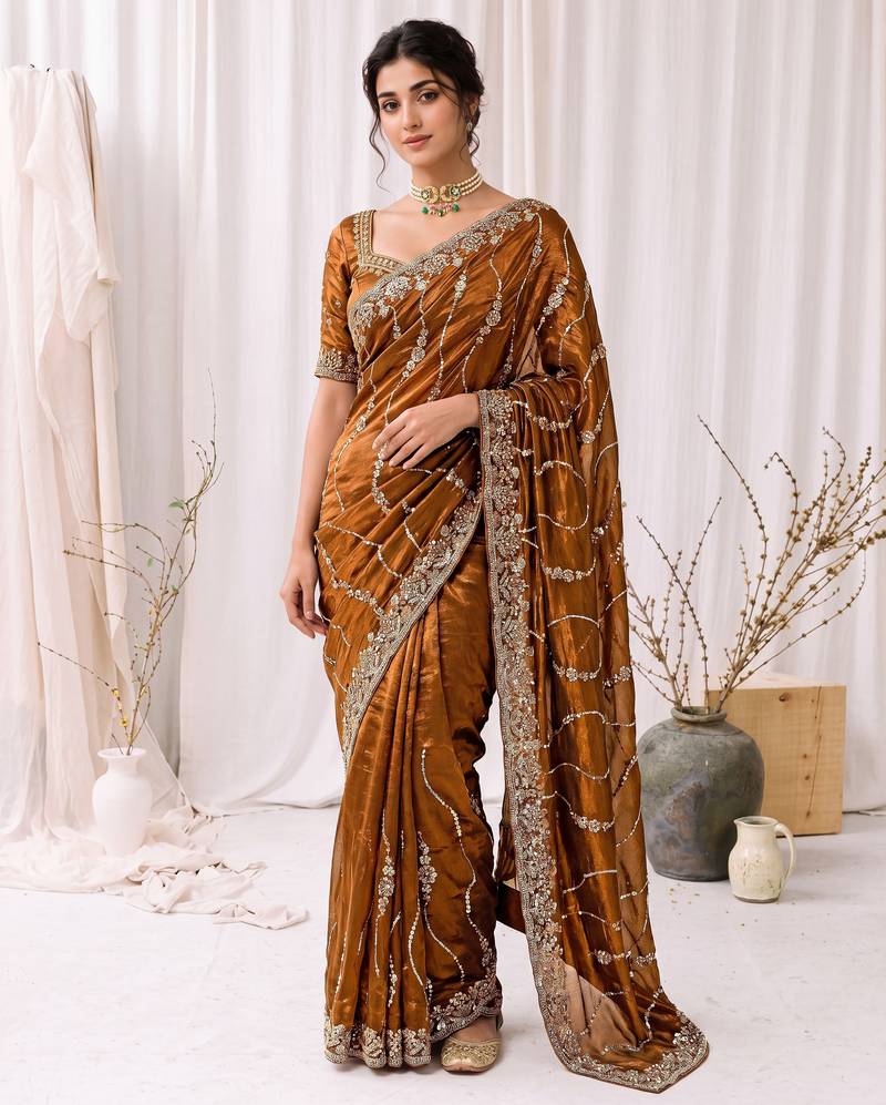 Gold color elegant space silk fabric rich looks embroidered saree