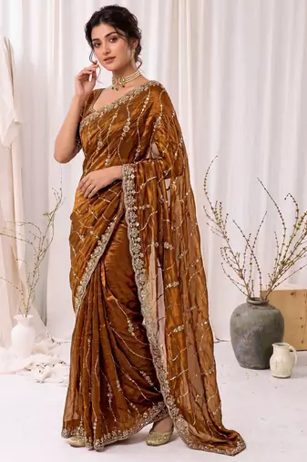 Gold color elegant space silk fabric rich looks embroidered saree