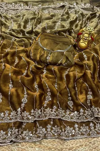Gold color elegant space silk fabric rich looks embroidered saree