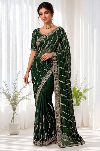 Green color elegant space silk fabric rich looks embroidered saree