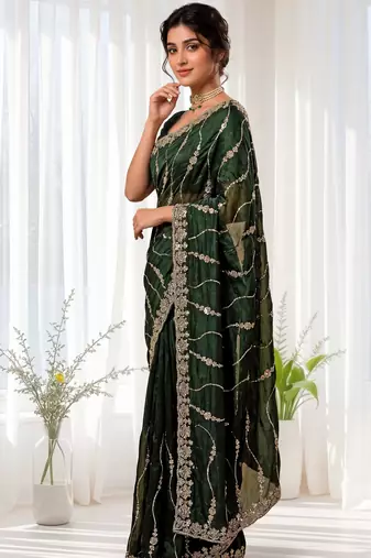 Green color elegant space silk fabric rich looks embroidered saree