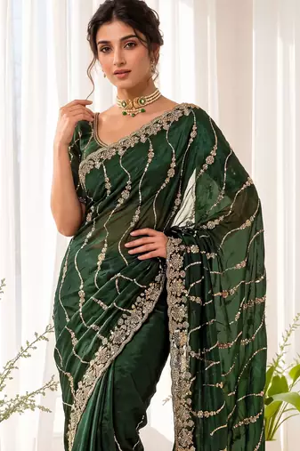 Green color elegant space silk fabric rich looks embroidered saree