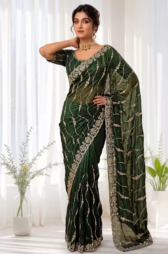 Green color elegant space silk fabric rich looks embroidered saree