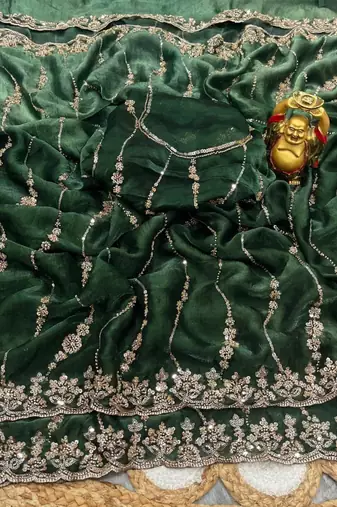Green color elegant space silk fabric rich looks embroidered saree