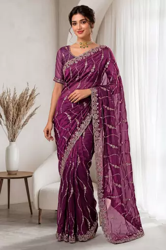 Burgundy color elegant space silk fabric rich looks embroidered saree