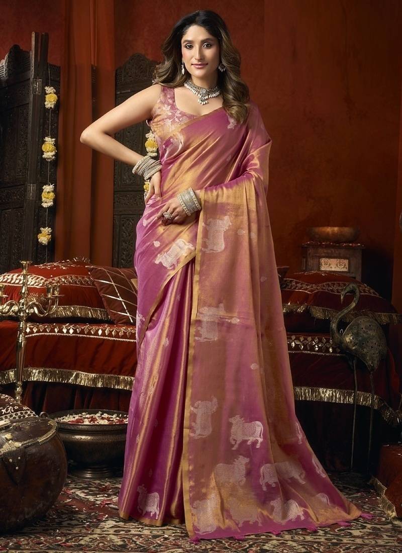 Peach heavy tissue with allover cow butta & fancy tassels saree