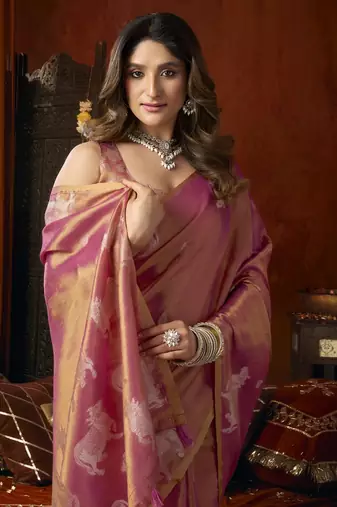 Peach heavy tissue with allover cow butta & fancy tassels saree