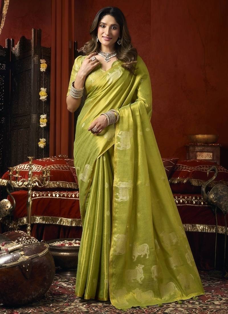 Olive heavy tissue with allover cow butta & fancy tassels saree