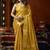 Golden heavy tissue with allover cow butta & fancy tassels saree