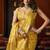 Golden heavy tissue with allover cow butta & fancy tassels saree