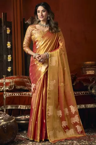 Orange green heavy tissue with allover cow butta & fancy tassels saree