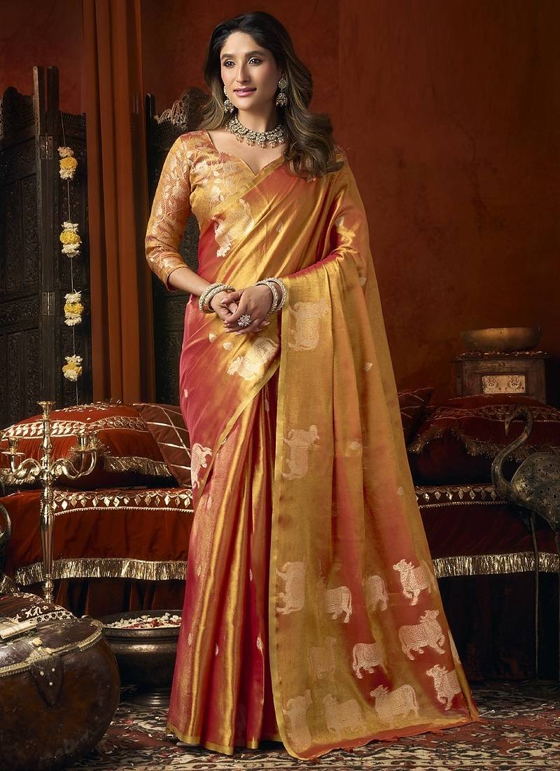 Orange green heavy tissue with allover cow butta & fancy tassels saree