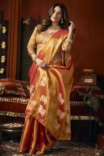 Orange green heavy tissue with allover cow butta & fancy tassels saree