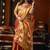 Orange green heavy tissue with allover cow butta & fancy tassels saree