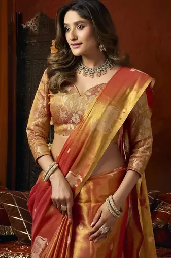 Orange green heavy tissue with allover cow butta & fancy tassels saree