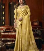 Cream green heavy tissue with allover cow butta & fancy tassels saree