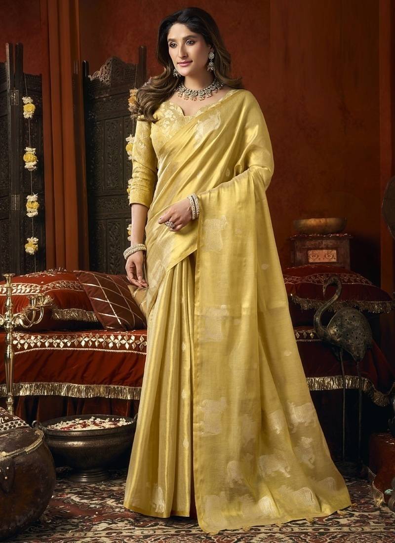 Cream green heavy tissue with allover cow butta & fancy tassels saree