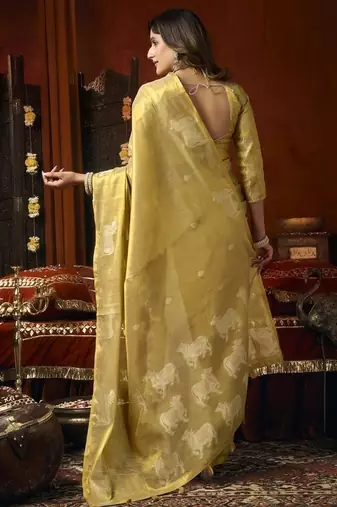 Cream green heavy tissue with allover cow butta & fancy tassels saree
