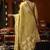 Cream green heavy tissue with allover cow butta & fancy tassels saree