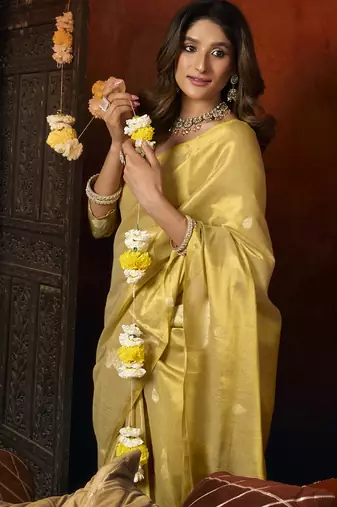 Cream green heavy tissue with allover cow butta & fancy tassels saree