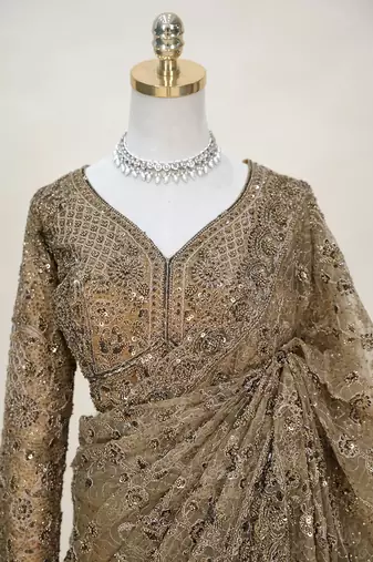 Luxury antique gold net saree with heavy embroidery for wedding reception festive wear