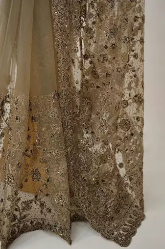 Luxury antique gold net saree with heavy embroidery for wedding reception festive wear