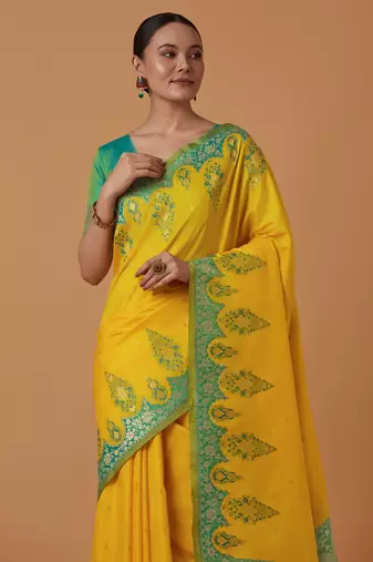 yellow silk blend banarasi jacuard work saree with unstitched blouse piece