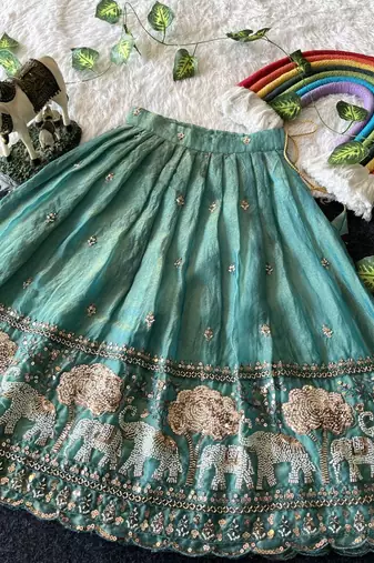 Kids moss satin elephant motif cutdana work lehenga with zari silk peplum blouse