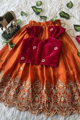 Orange fendy silk embroidered lehenga with red velvet work blouse for kids