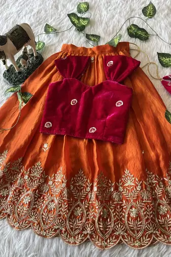 Orange fendy silk embroidered lehenga with red velvet work blouse for kids
