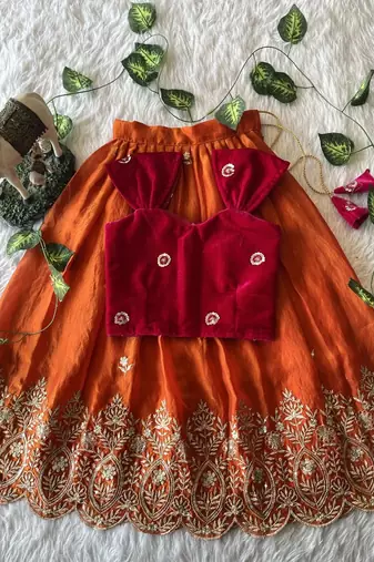 Orange fendy silk embroidered lehenga with red velvet work blouse for kids