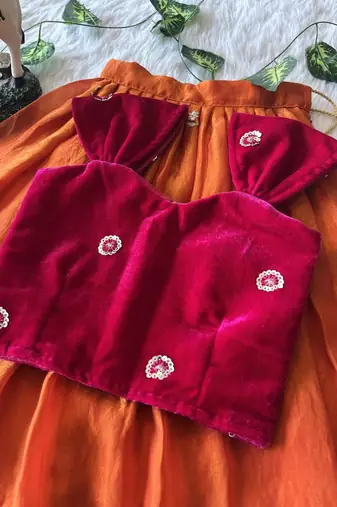 Orange fendy silk embroidered lehenga with red velvet work blouse for kids