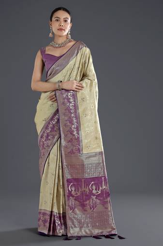 Cream banarasi silk blend jacuard work saree with unstitched blouse piece