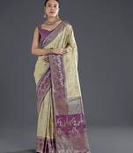 Cream banarasi silk blend jacuard work saree with unstitched blouse piece